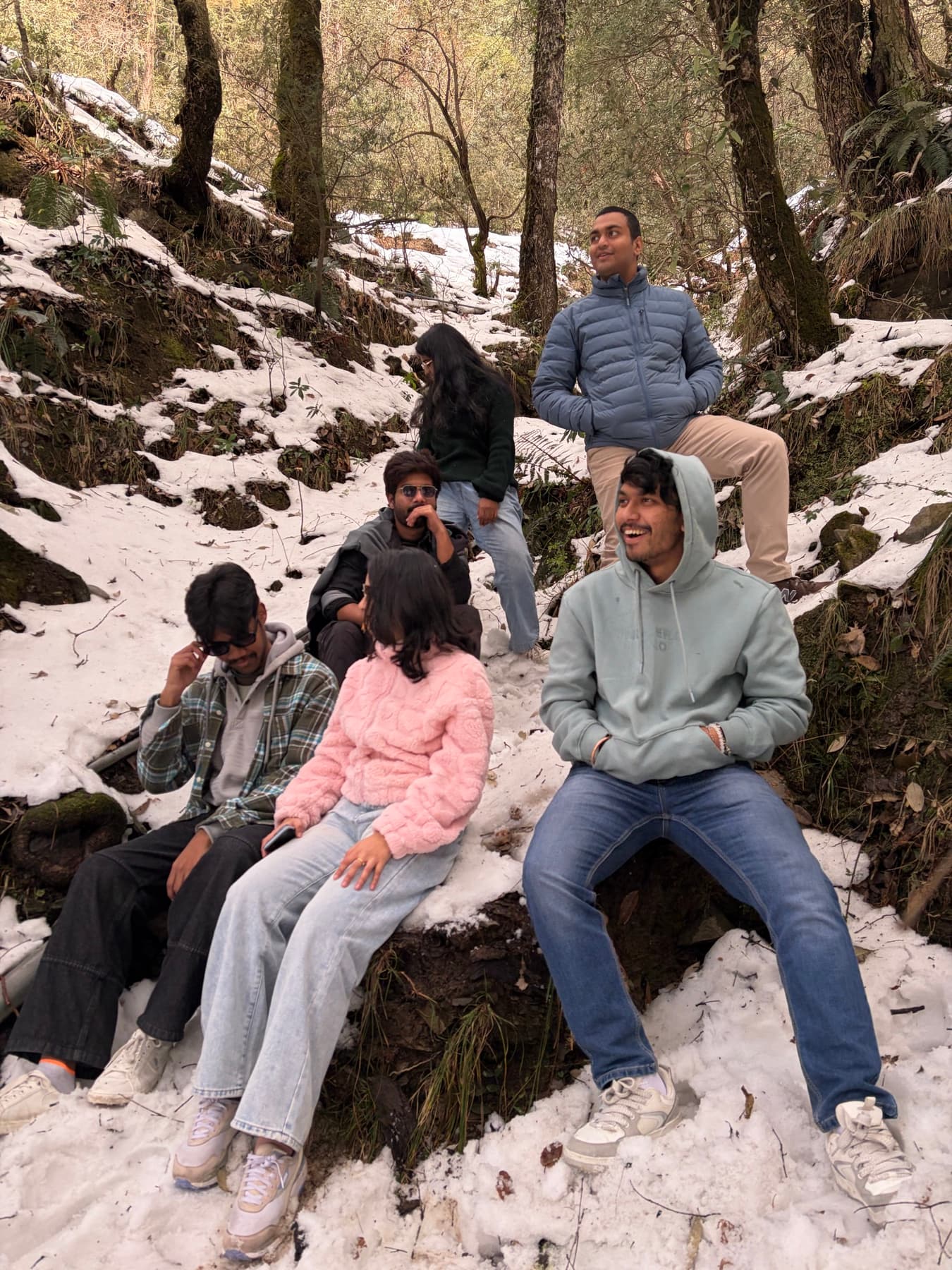 Friends sitting together during a cold-weather trip